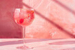 Refreshing summer cocktail on pink background in natural light, generative ai