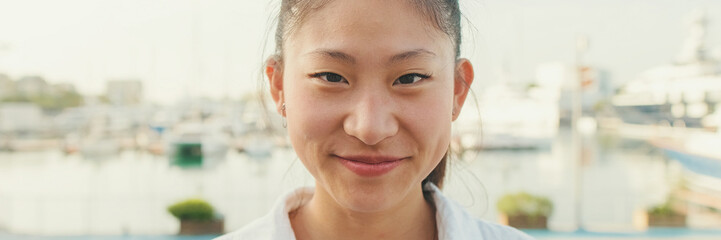 Poster - Close up, young woman looking at the camera and laughing, Panorama