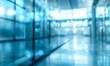 © AhmadTriwahyuutomo - Blurry glass façade of a modern business office in the bustling city center, ideal for business-themed backgrounds. Captures the essence of corporate work environment