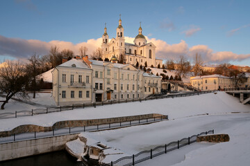 Wall Mural - View of the Assumption Mountain, the Holy Spirit Monastery and the Holy Assumption Cathedral on the banks of the Western Dvina and Vitba rivers on a sunny winter day, Vitebsk, Belarus