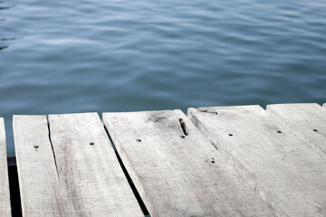 Wooden boardwalk with blue sea