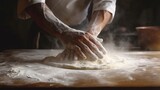 Fototapeta  - Male hands kneading dough on wooden table in kitchen, closeup