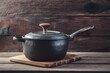 Iron pot rests atop wooden surface, adding rustic kitchen charm