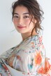 Close-up of a Japanese Super Model in a Flowy Floral Wrap Dress, exuding effortless elegance with a serene smile photo on white isolated background