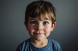 Portrait of a cute little boy with blue eyes looking at camera