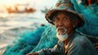Aged Asian fisherman with fishing nets