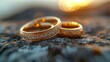   A few wedding rings atop a bed of snow, adjacent to two diamond-encrusted ones