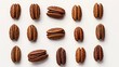 An arrangement of pecans on a white surface, captured from above to showcase their uneven, brown textures and distinctive, lobed shapes