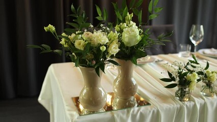 Sticker - a beautiful wedding table with decor of flowers food and drinks for an banquet in the restaurant