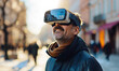Attractive man wearing virtual reality glasses outdoor.