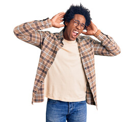 Canvas Print - Handsome african american man with afro hair wearing casual clothes and glasses trying to hear both hands on ear gesture, curious for gossip. hearing problem, deaf