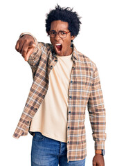 Sticker - Handsome african american man with afro hair wearing casual clothes and glasses pointing displeased and frustrated to the camera, angry and furious with you