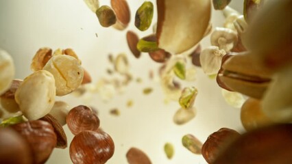 Poster - Super Slow Motion of Flying Nuts Mix in Rotating Movement. Filmed on High Speed Cinema Camera , 1000fps.