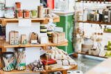 Fototapeta Tęcza - Zero waste shop interior. Wooden shelves with varieties of cosmetic products.