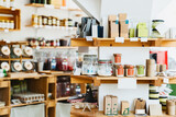 Fototapeta Tęcza - Zero waste shop interior. Wooden shelves with varieties of cosmetic products.