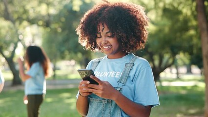 Poster - Charity, volunteer and smile of woman with phone for donation or typing email in nature. Community service, smartphone and African person online, NGO or social media for non profit at park outdoor