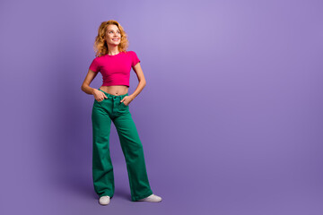 Wall Mural - Photo of lovely pretty woman wear stylish clothes look empty space news isolated on purple color background