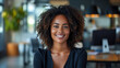Young african american business woman smiling closeup portrait blur office background