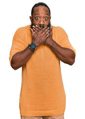 Poster - Young african american man wearing casual clothes shocked covering mouth with hands for mistake. secret concept.