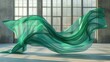 Graceful folds of emerald silk caught mid-flow, conveying elegance and luxury against an industrial backdrop, ideal for fashion design and sophisticated textile presentations.