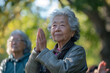 © YouAreBeautiful - Seniors taking a gentle tai chi class in the park