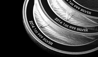 Wall Mural - Close up of  Silver Bullion Coin on a black mirror background