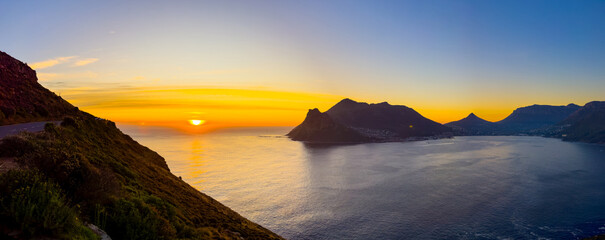 Wall Mural - Hout Bay coastal mountain landscape at sunset in Cape Town.