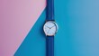 A single elegant wristwatch placed against a pristine solid color backdrop, minimalist composition
