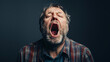 portrait of a yawning screaming man
