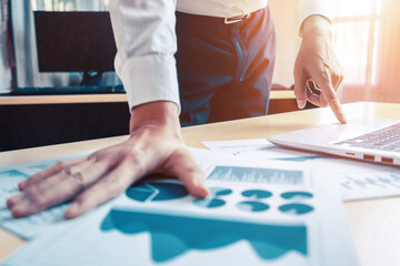 Poster - businessman accountant or financial expert analyze business report graph and finance chart at corpor