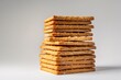 a stack of crackers on a white surface