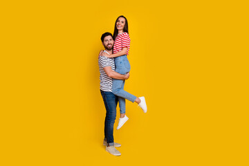 Aufkleber - Full length photo of boyfriend hold on hands his gorgeous girlfriend wear striped t-shirt isolated on vivid yellow color background