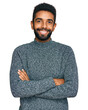 © Krakenimages.com - Young african american man wearing casual clothes happy face smiling with crossed arms looking at the camera. positive person.