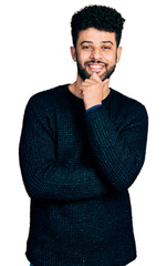 Sticker - Young arab man with beard wearing casual winter sweater smiling looking confident at the camera with crossed arms and hand on chin. thinking positive.