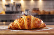 Chocolate Chip Croissant on Wooden Board