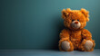 Teddy bear sitting on blue wall toy animal cute