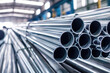 Galvanized steel pipe, or aluminum and chrome stainless pipes stacked in warehouse