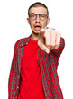 Hispanic young man wearing casual clothes pointing displeased and frustrated to the camera, angry and furious with you