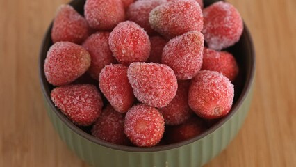 Wall Mural - Frozen organic strawberries in a bowl. Rotating 360 Degrees Video