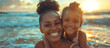 Happy black mother and daughter playing on beach with room for text, sister gives piggyback ride to little girl by the shore, lovely child hugs her mom. Family bonding on a sunny beach vacation.