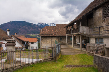 Wall Mural - Historic residential buildings in the mountain village of Ovasta in Carnia, Udine Province, Friuli-Venezia Giulia, north east Italy