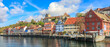 Picturesque panorama of the lakeshore of the town Meersburg at Lake Constance with the building Gredhaus and the medieval castle Burg Meersburg on a rocky outcropping in the background.