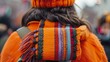 Close-up of a person wearing an orange shirt on Orange Shirt Day, embodying the spirit of truth and reconciliation during their travels