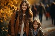 Portrait of a mother with her daughter, mother takes her daughter to school on an autumn day,