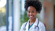 Young smiling doctor woman afro american portrait