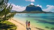 A couple on a tropical island strolling along the beach