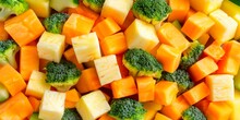 Diced Broccoli And Carrots In A Vibrant Display Of Green And Orange, Ready For Cooking.