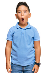 Canvas Print - Little boy hispanic kid wearing casual clothes afraid and shocked with surprise and amazed expression, fear and excited face.