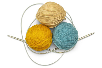 several multi-colored skeins of wool yarn with knitting needles, isolated on a transparent backgroun