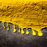 Fototapeta Las - Yellow Dripping Paint Texture on Concrete